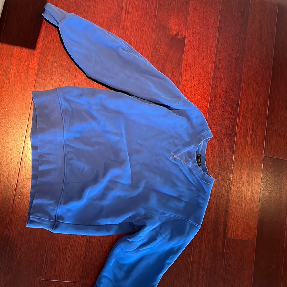 Blue sweatshirt with small cutout design